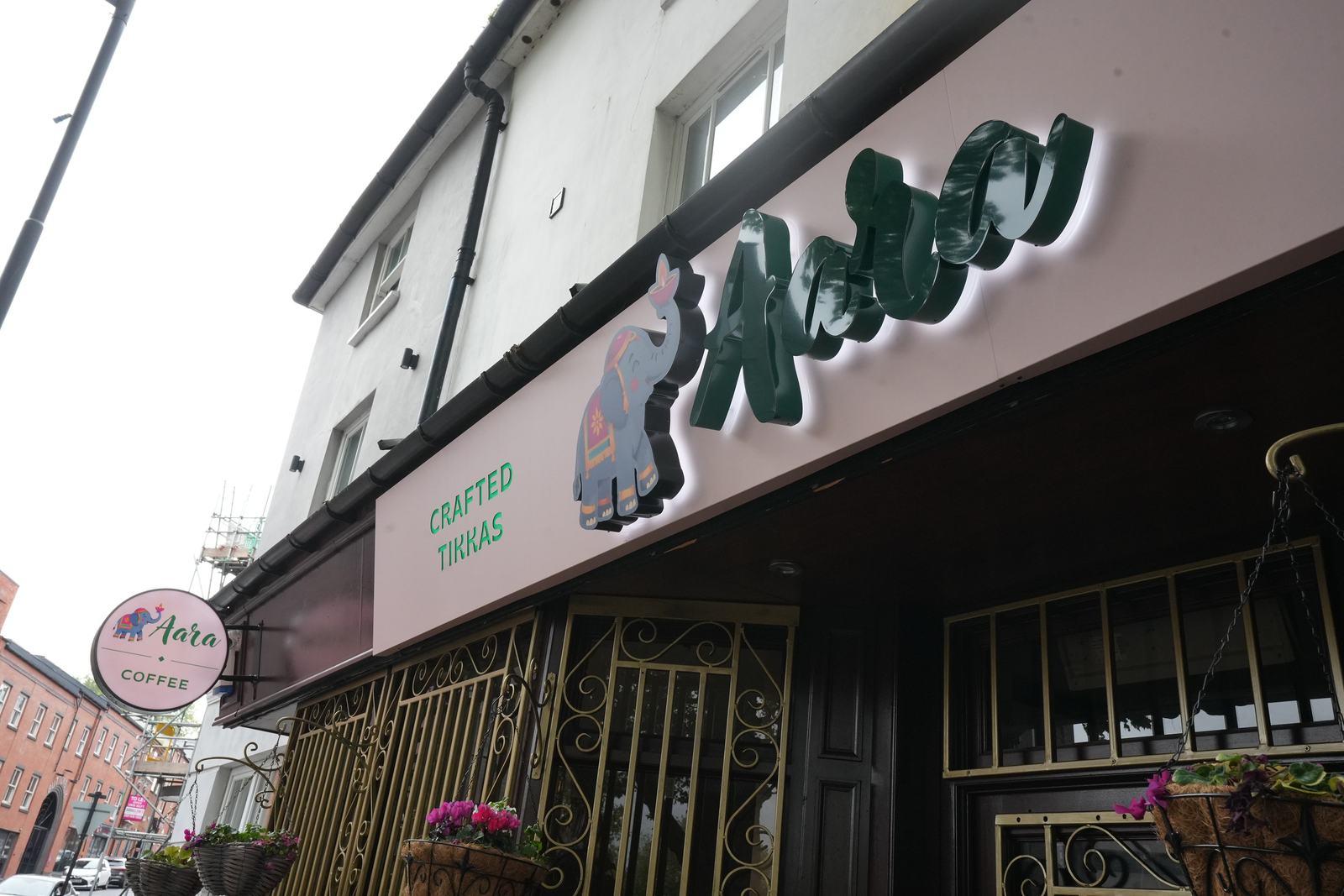 Aara storefront on Icknield Street with the green elephant sign